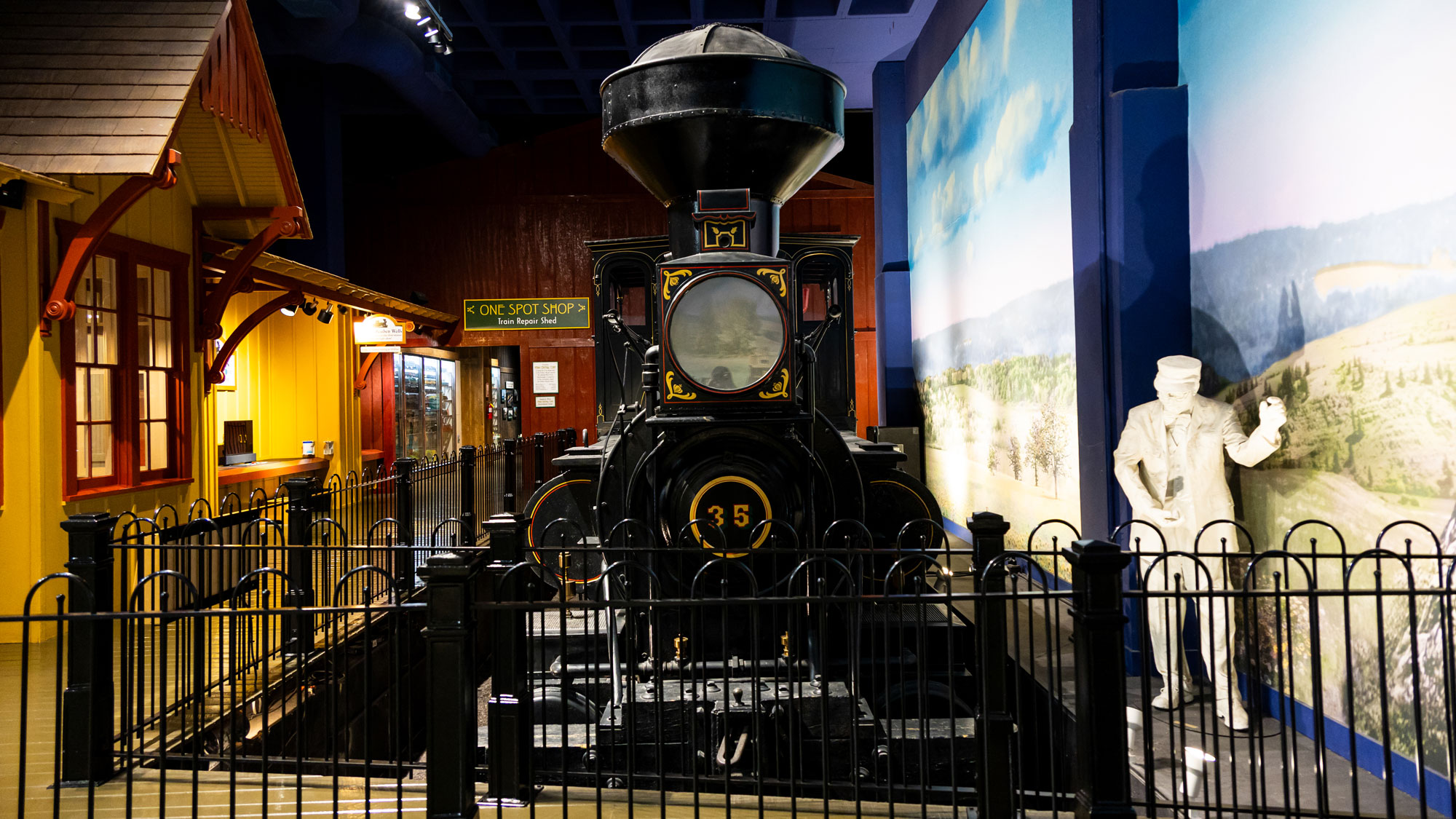 Reuben Wells locomotive and statue of conductor.