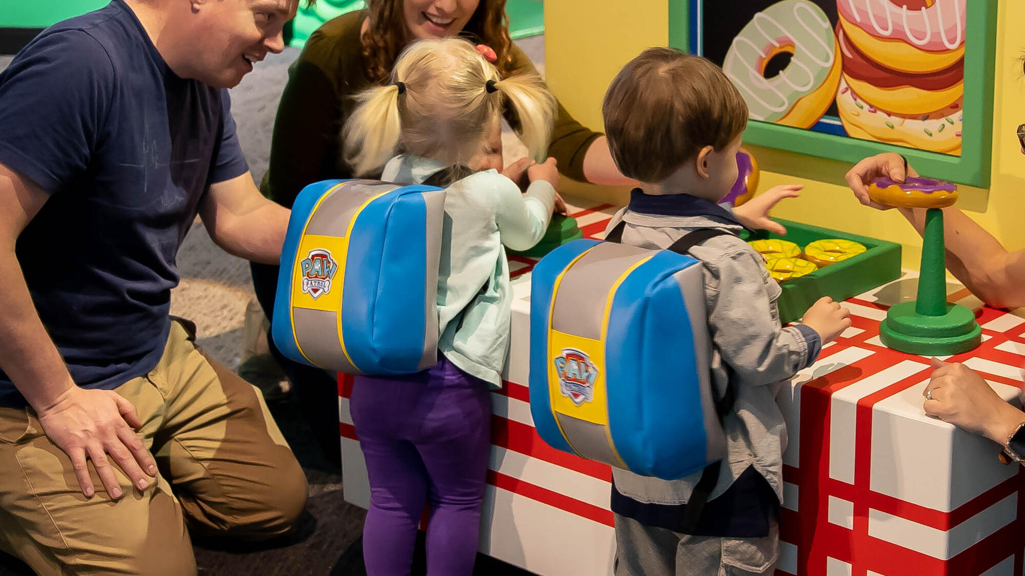 Children wearing pup packs.