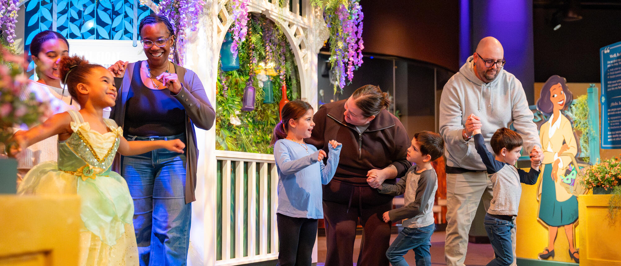 Tiana’s Joyful Celebration logo with exhibit concept drawings and artist tools.