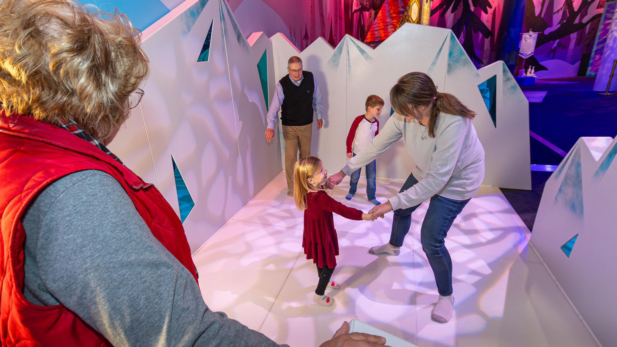 Family sock skating in the WinterFaire exhibit.