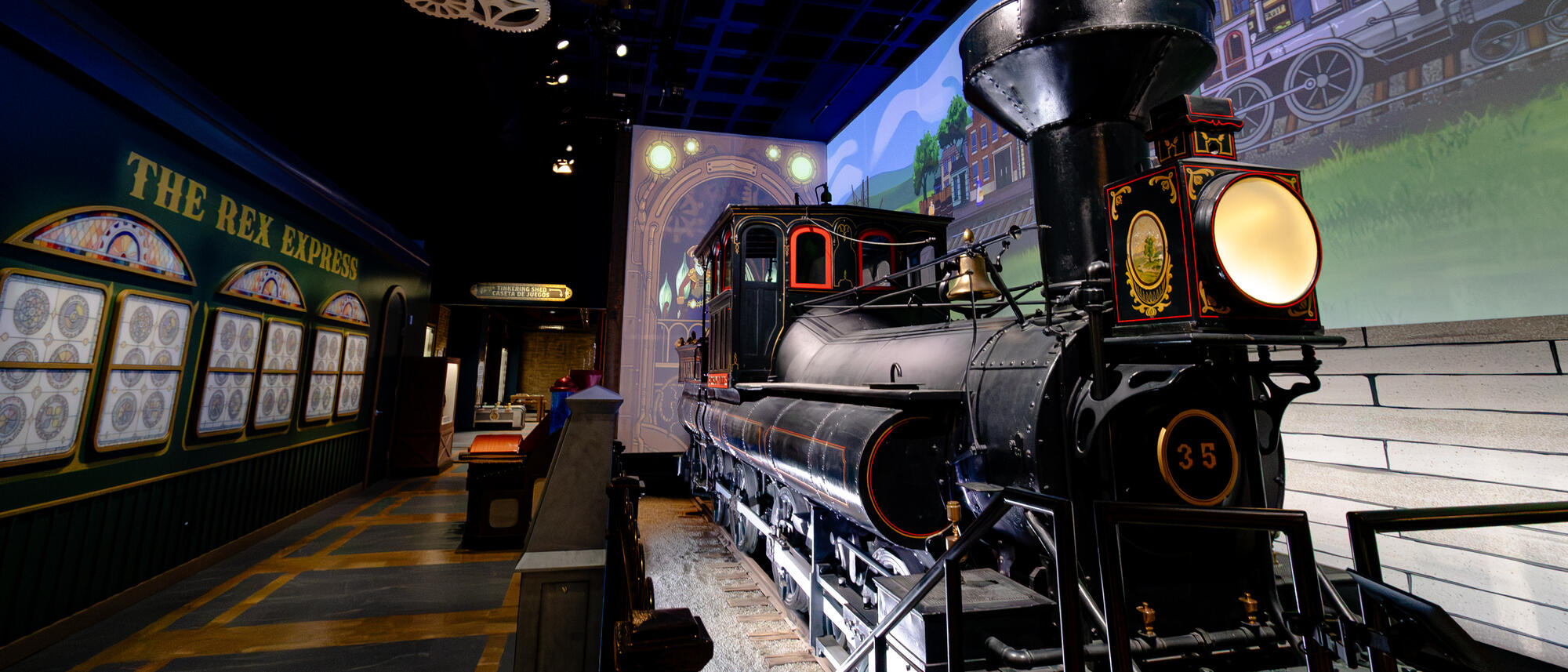 Families looking at the Reuben Wells train inside the exhibit.