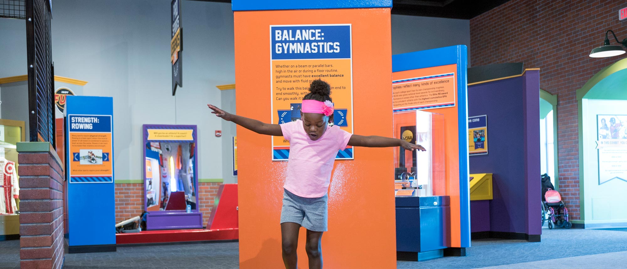 Child walking on a balance beam.