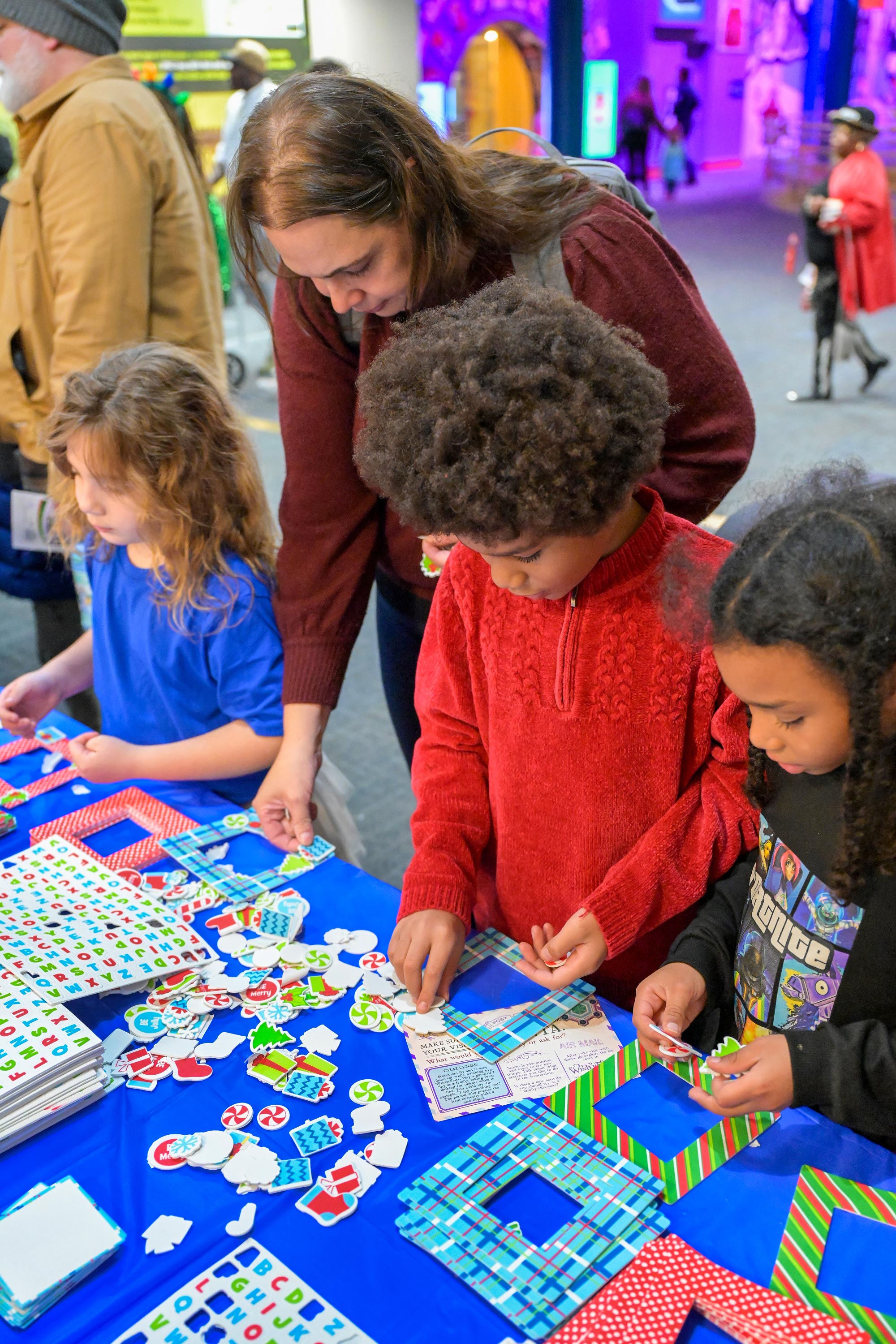 People making crafts at a table.