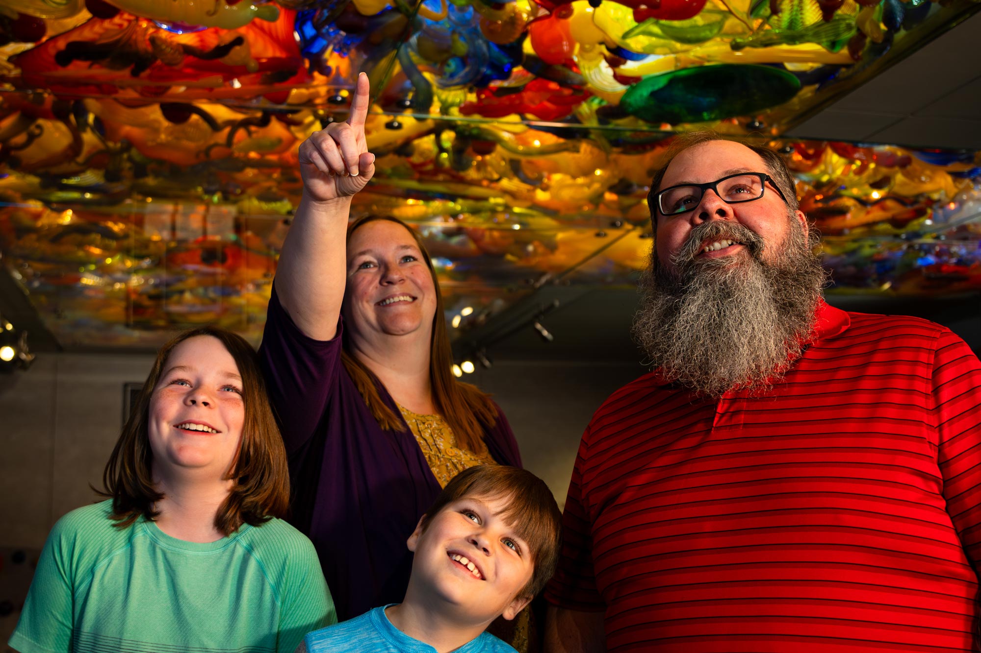 Family underneath Fireworks of Glass sculpture.
