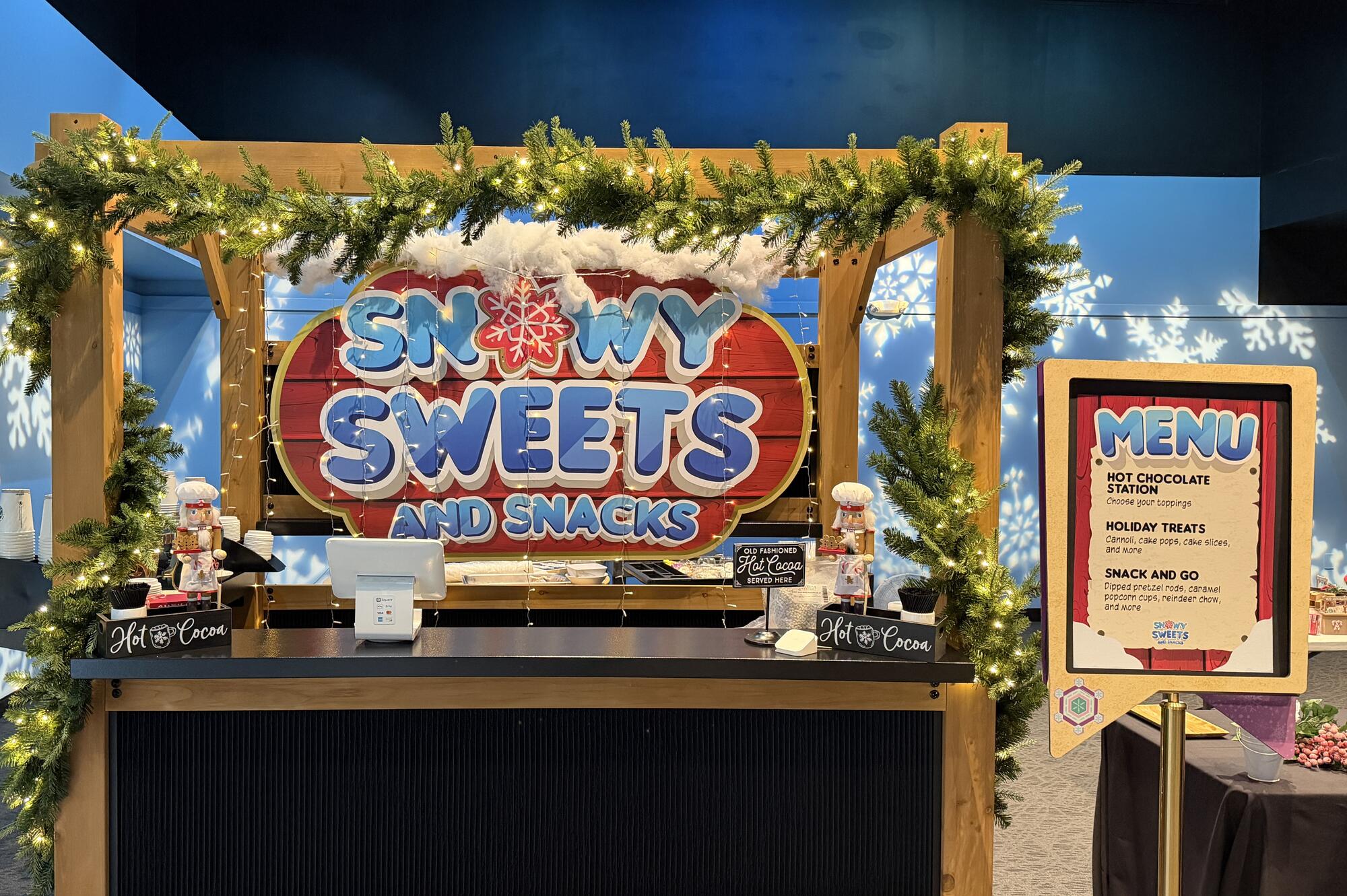 Snowy Sweets and Treats sign.