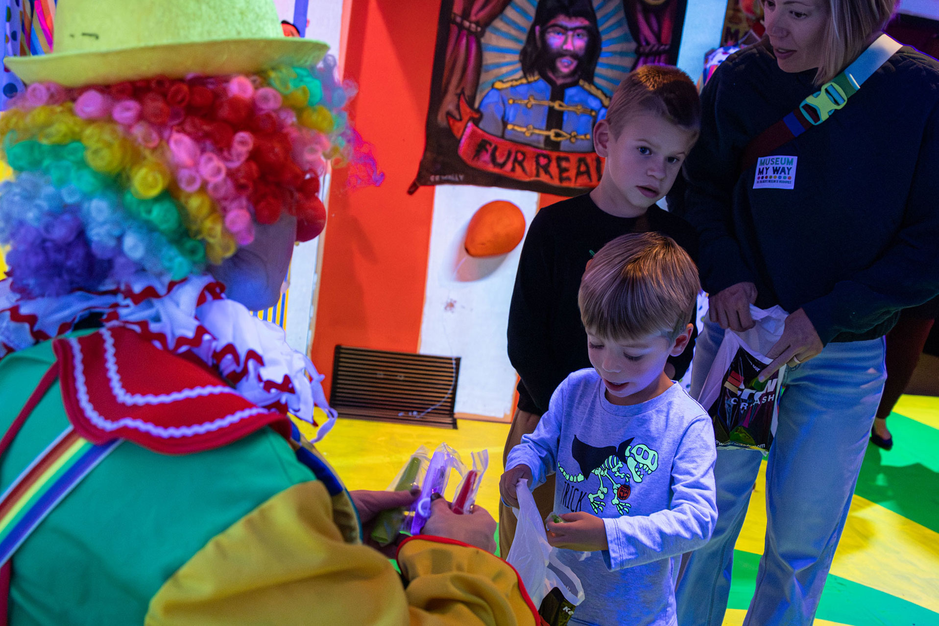 Clown handing out candy.