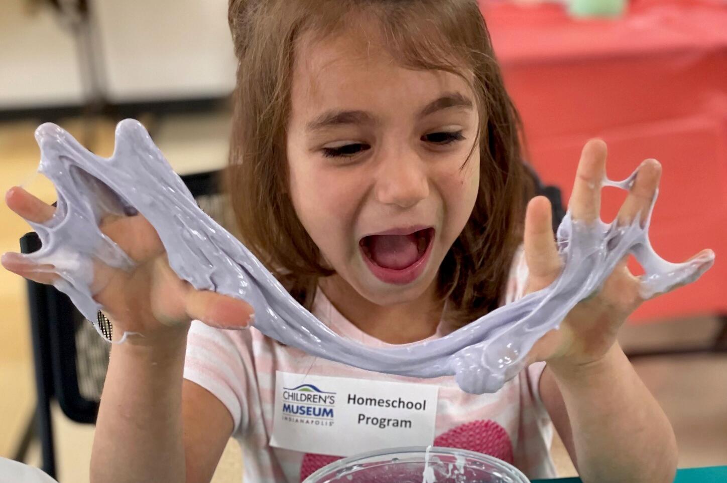 Child holding slime.