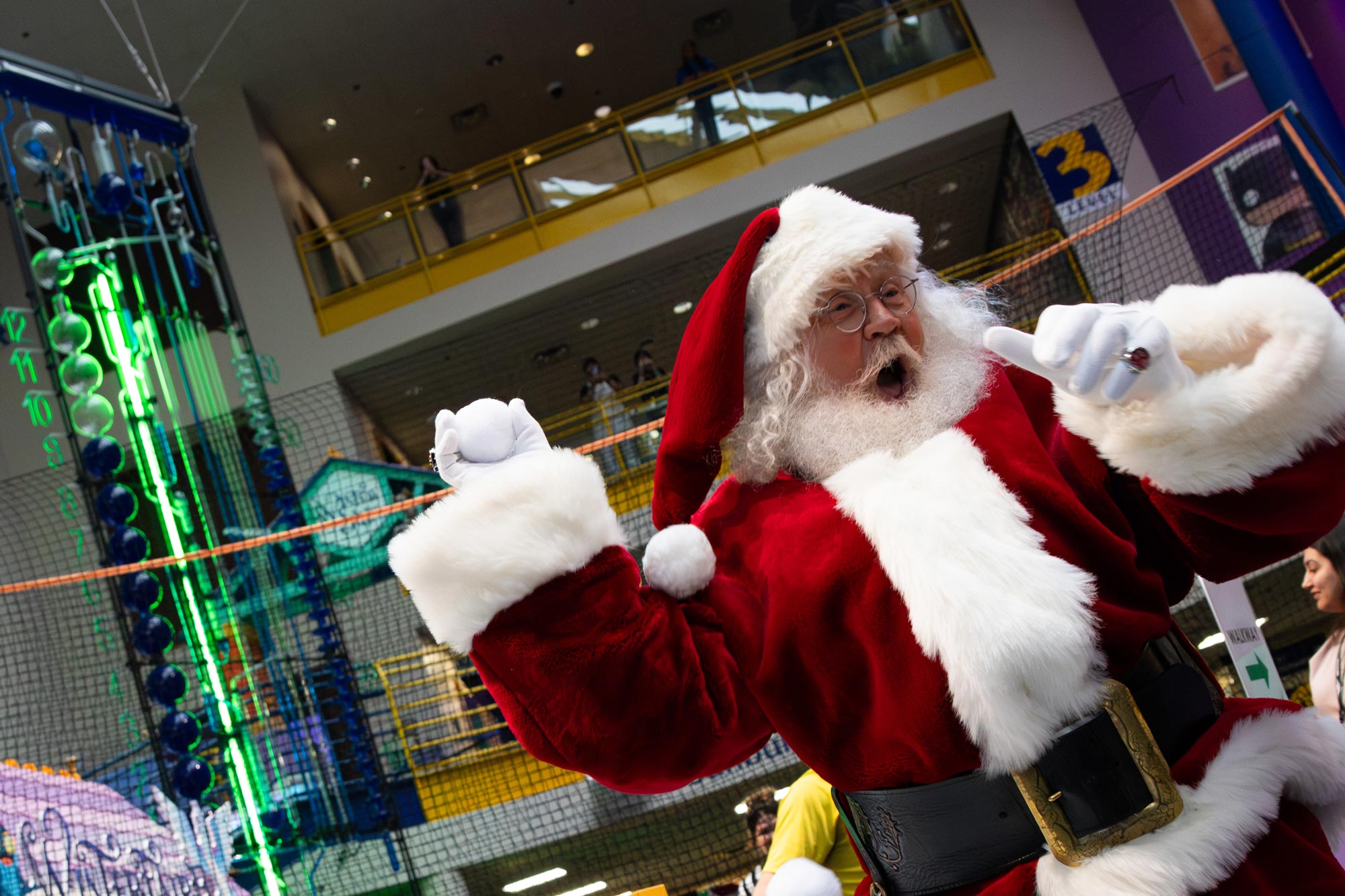 Santa throwing a snowball at Indy's biggest indoor snowball fight.