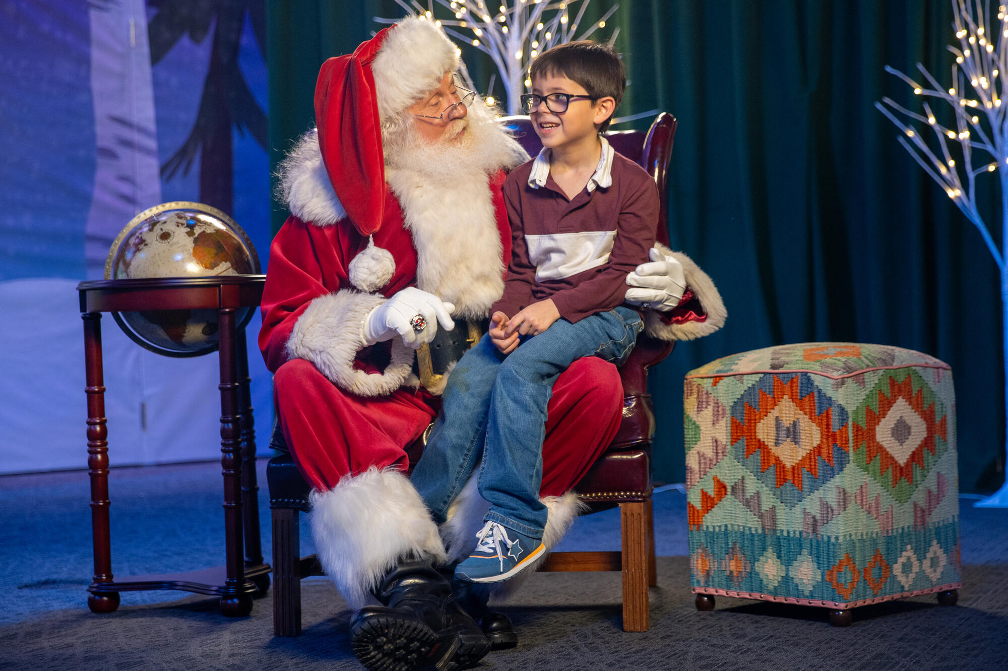 Child sitting on Santa's lap.