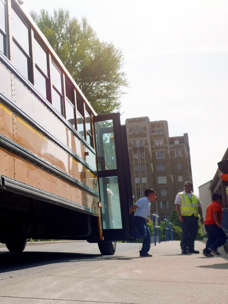 Students unloading school bus.