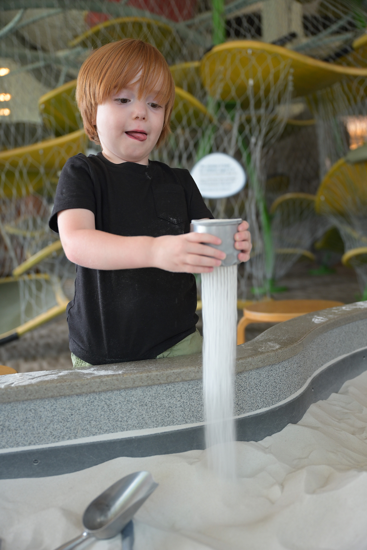 Child playing with sand.