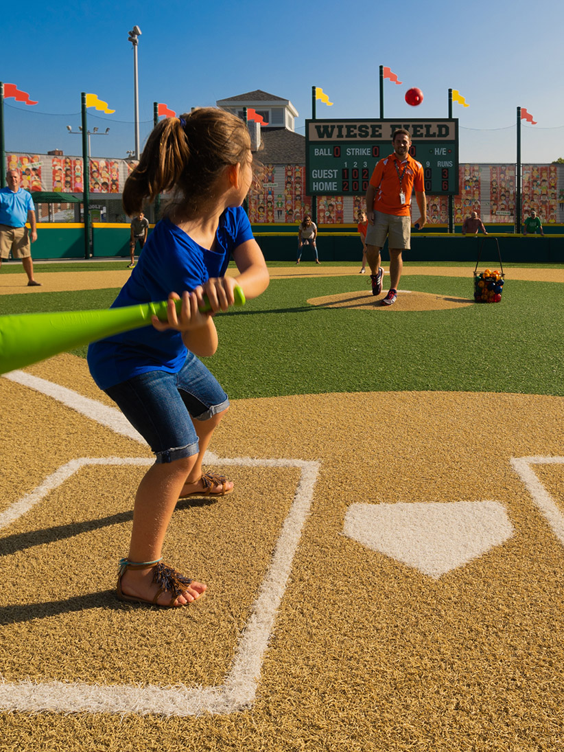 Child getting ready to swing a baseball bat.