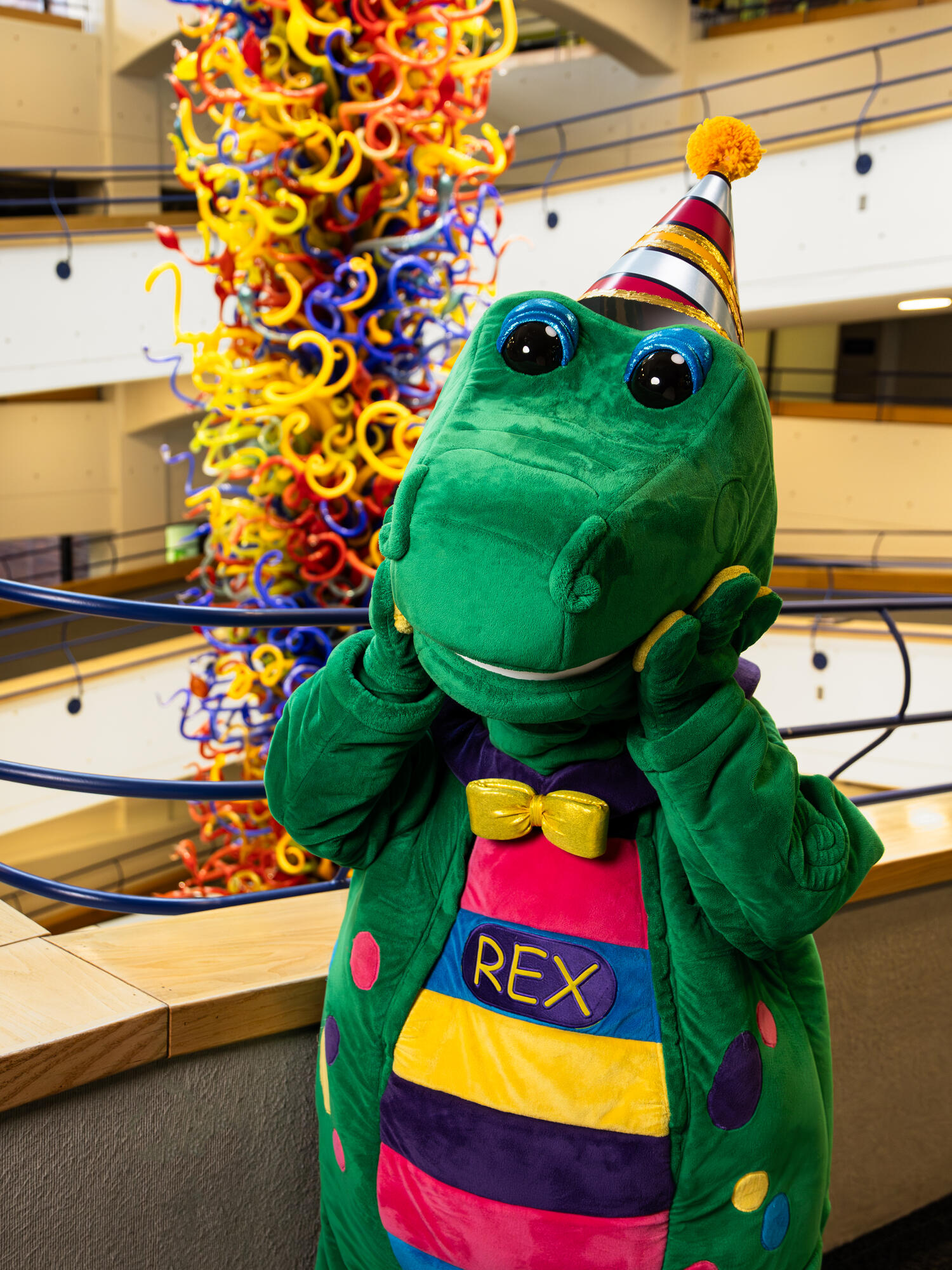Statue of Rex, the mascot, in front of Fireworks of Glass tower.
