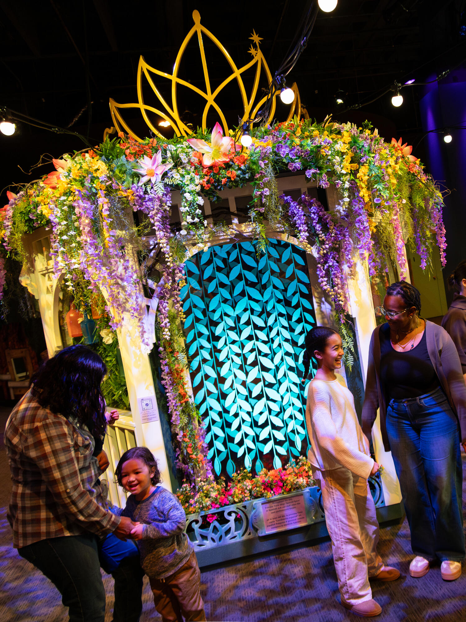 Families in front of the food-themed float.