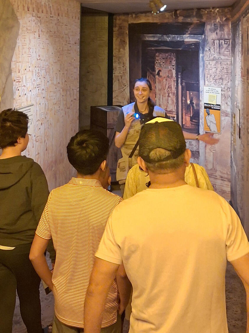 Staff member leading a group through Seti's tomb in National Geographic Treasures of the Earth.