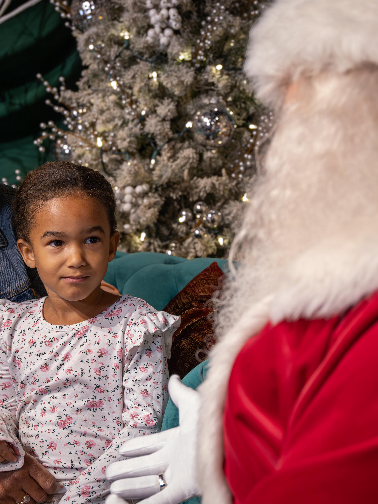 Santa talking with a child.