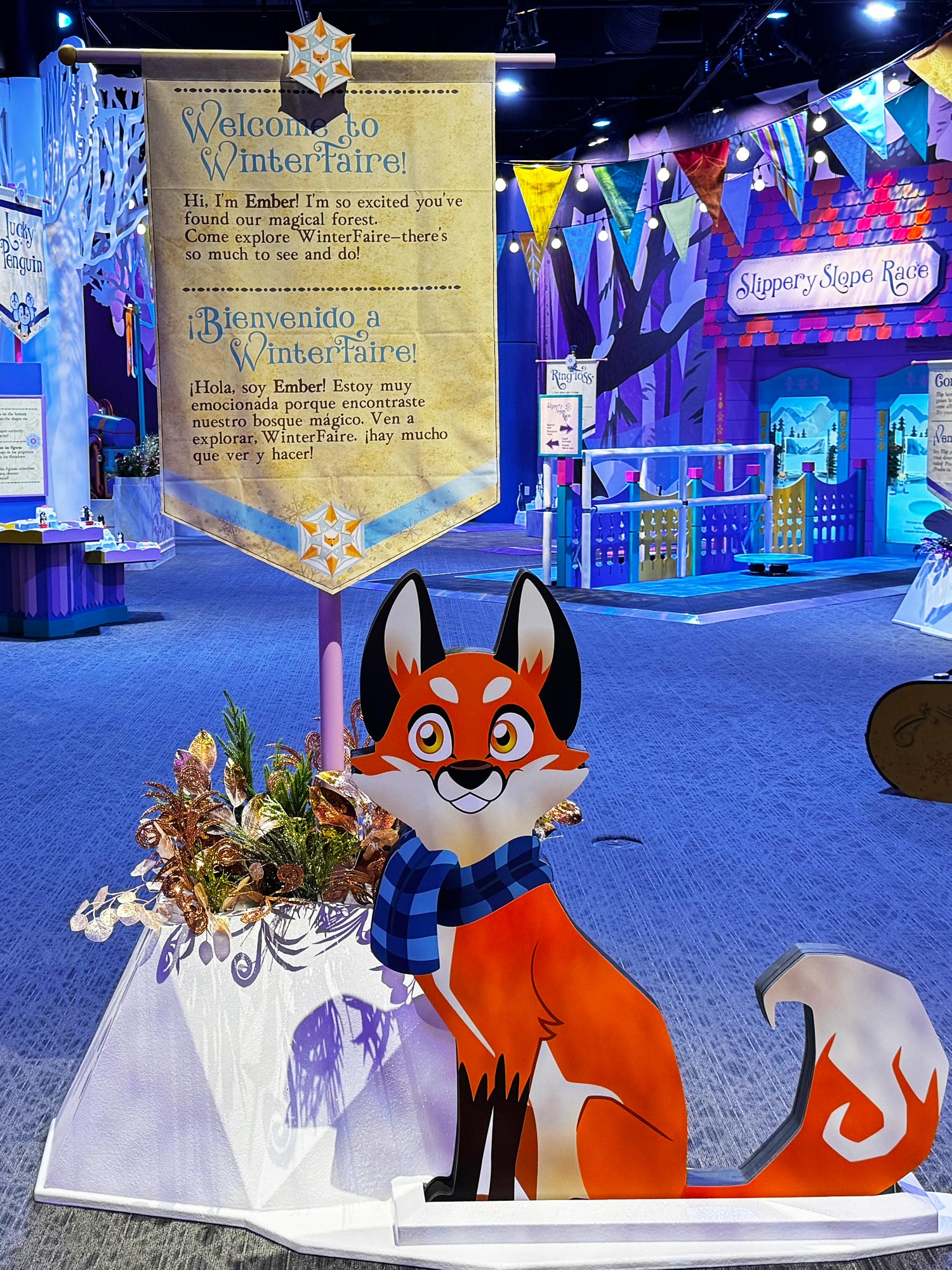 A statue of Ember the fox at the entrance to the WinterFaire exhibit.