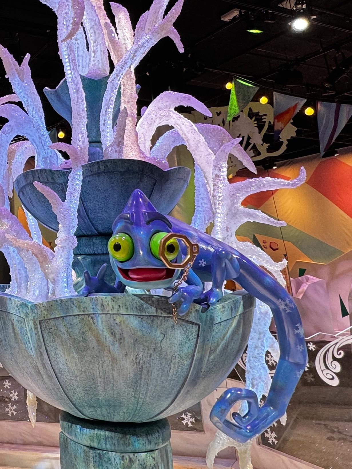 Indigo the chameleon at the frozen fountain.