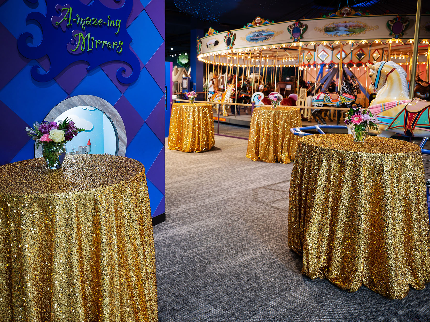 Decorated tables in Carousel Wishes and Dreams exhibit.