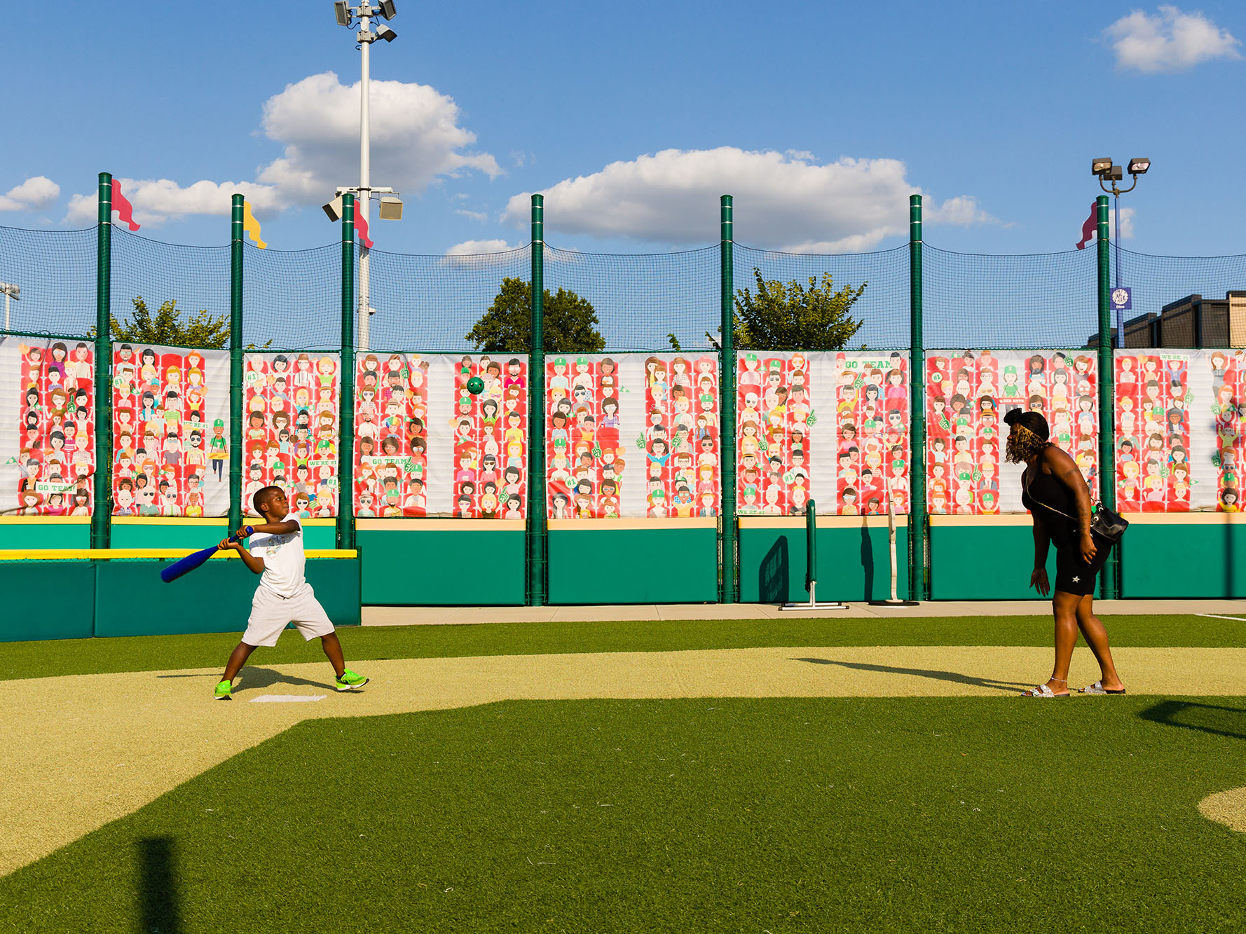 Child hitting a baseball.