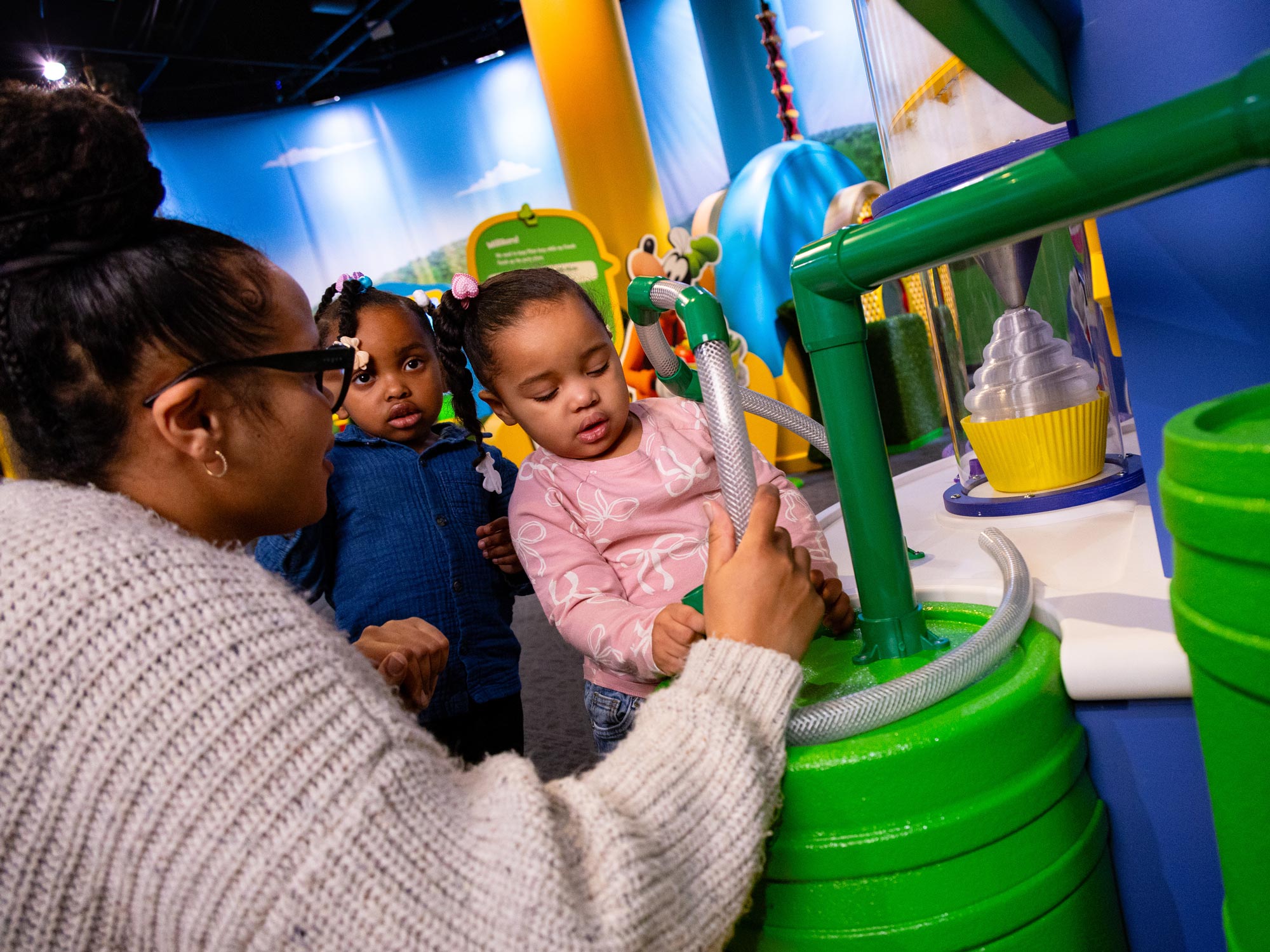 Family playing in exhibit.