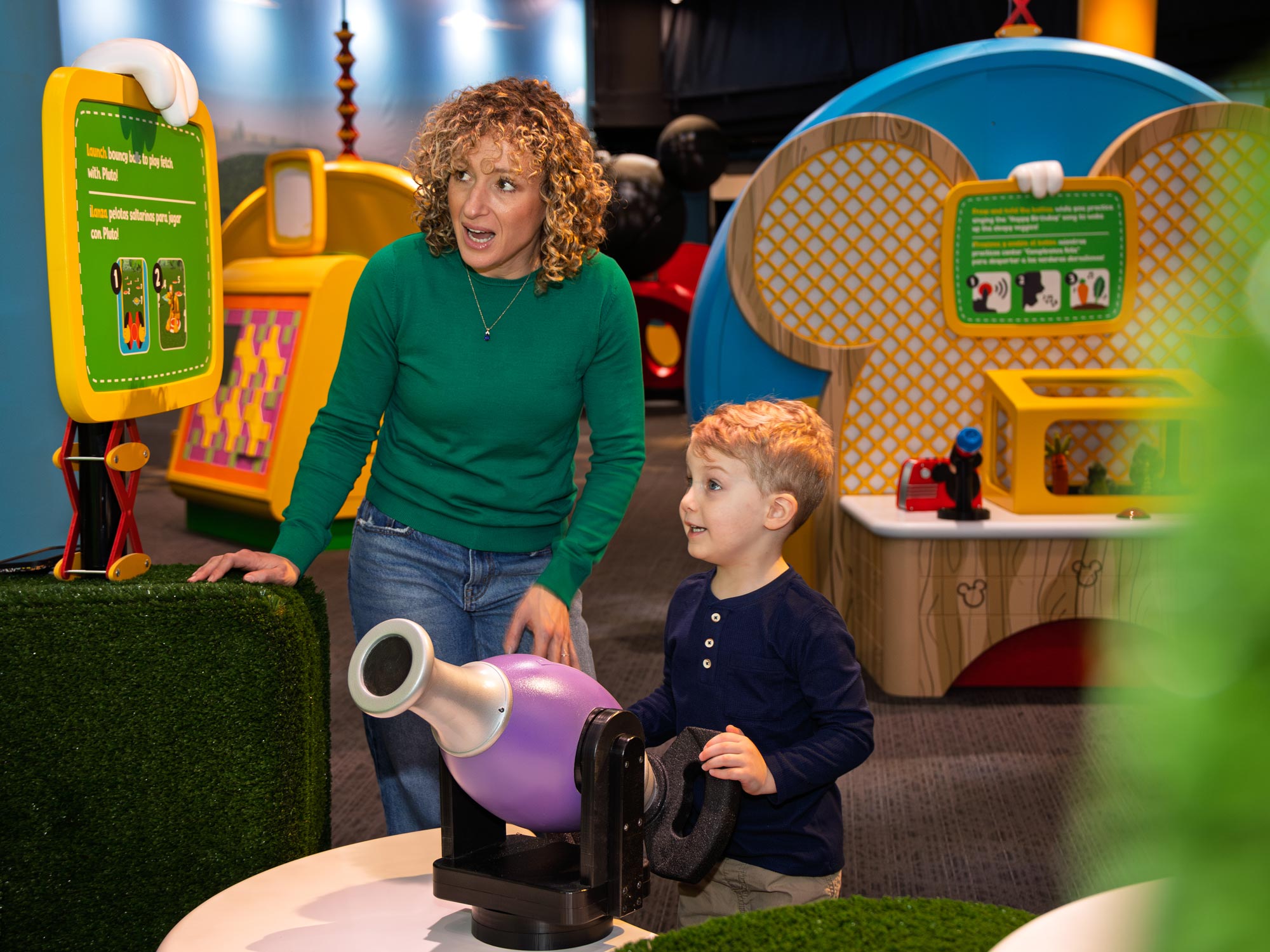 Grown-up and child laying in the exhibit.