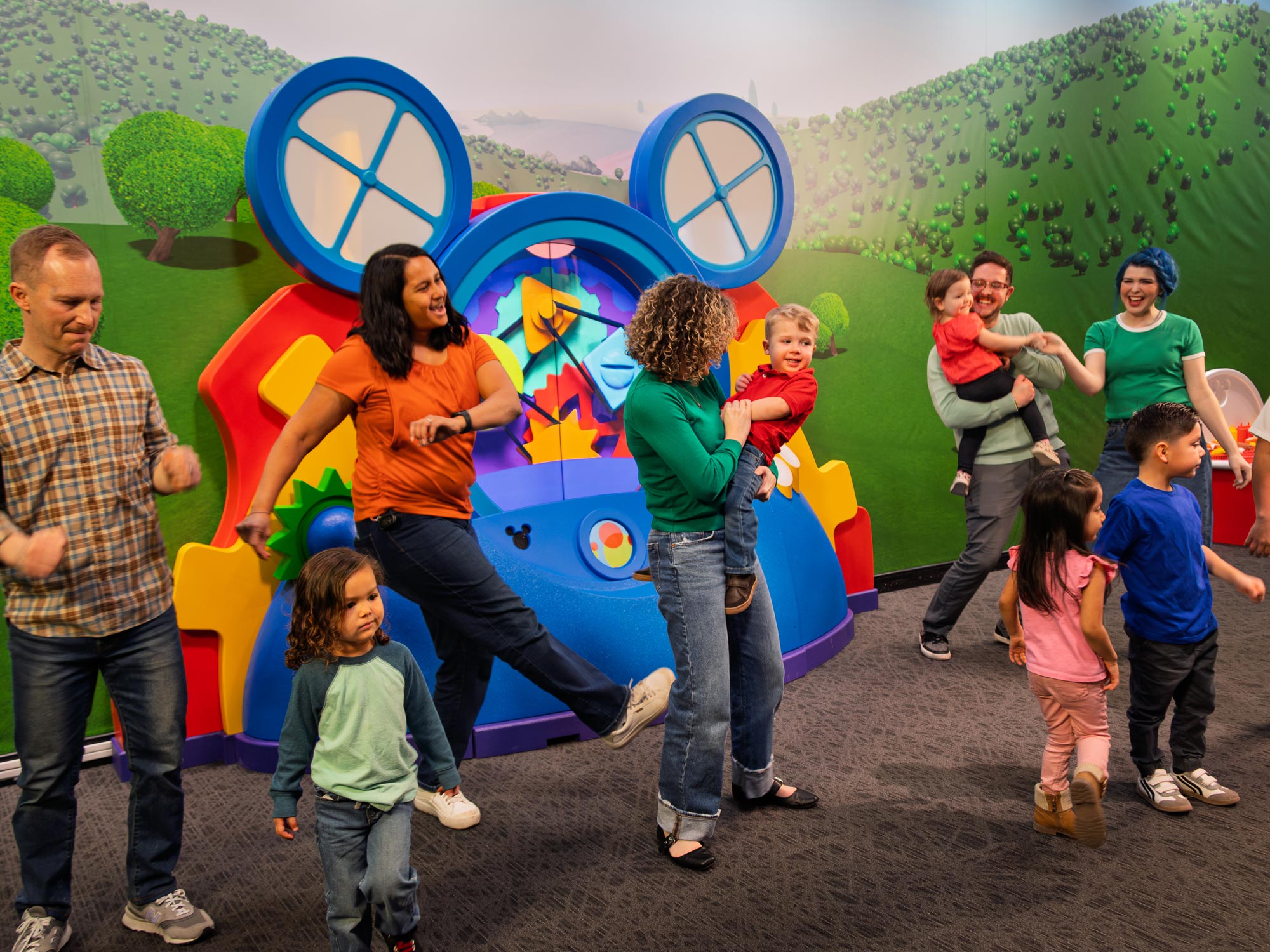 Families dancing the Hot Dog Dance in the exhibit.