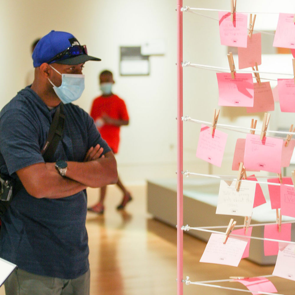 Access Pass - Family wearing masks at the Indiana State Museum