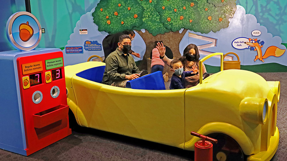Fill a car with nuts in Tico's Nutty Forest in Nickelodeon's Dora and Diego—Let's Explore! at The Children's Museum of Indianapolis