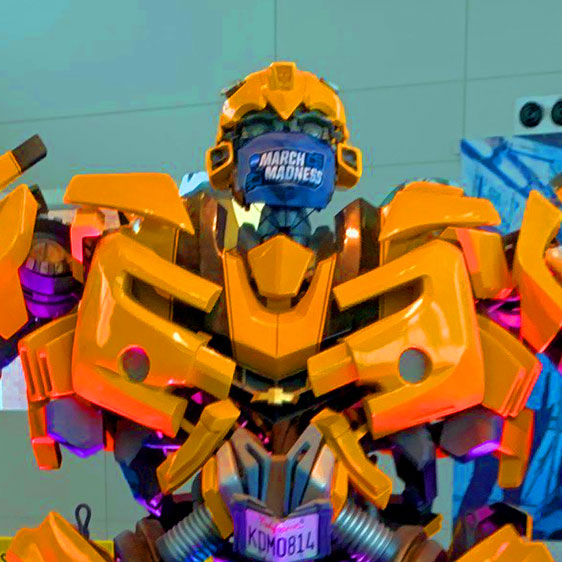 Bumblebee wearing a March Madness face covering inside the Welcome Center at The Children's Museum of Indianapolis