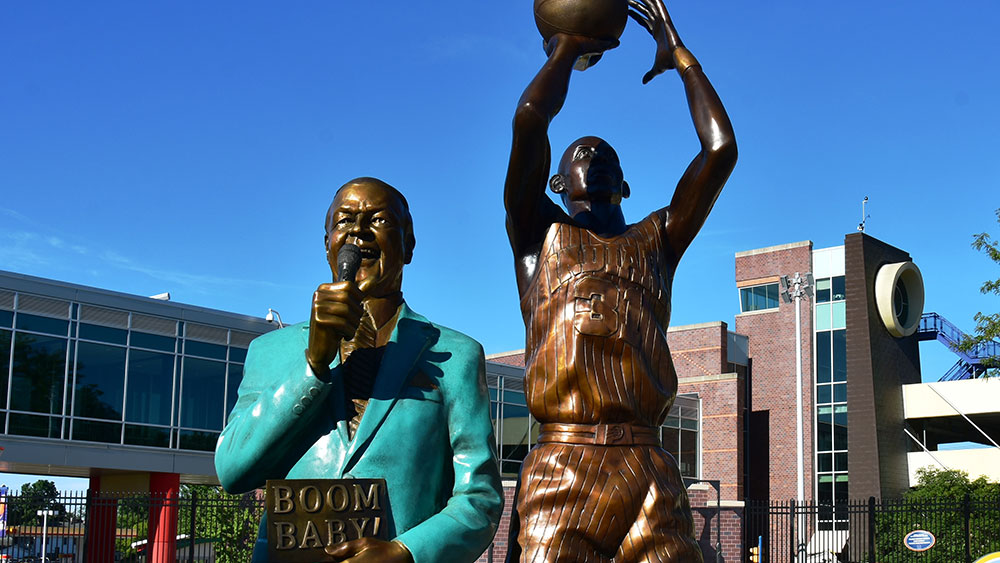 Statues of Reggie Miller and Slick Leonard on the Old National Bank Sports Legends Avenue of Champions in the Riley Children's Health Sports Legends Experience at The Children's Museum of Indianapolis