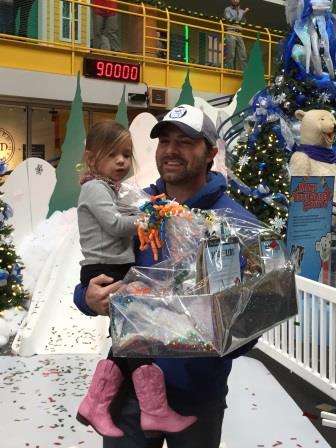 Adelaide Reed of Indianapolis took the 90,000th ride down the Yule Slide with her dad Clint.