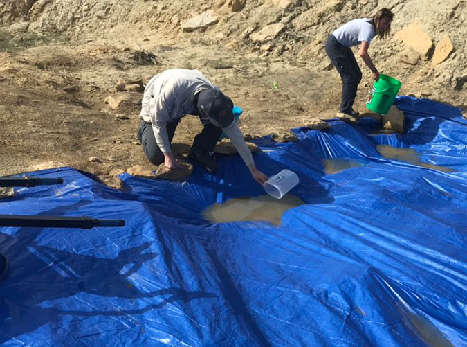Water filled tarp at the Mission Jurassic dig site