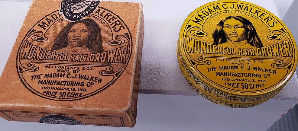 Madam C.J. Walker hair care product tins from the 1920s on display at The Children's Museum of Indianapolis