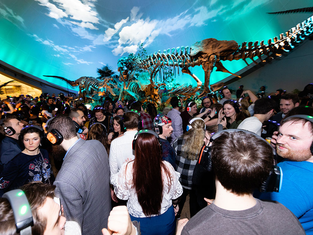 Silent disco with the dinosaurs in Dinosphere during Museum by Moonlight at The Children's Museum of Indianapolis