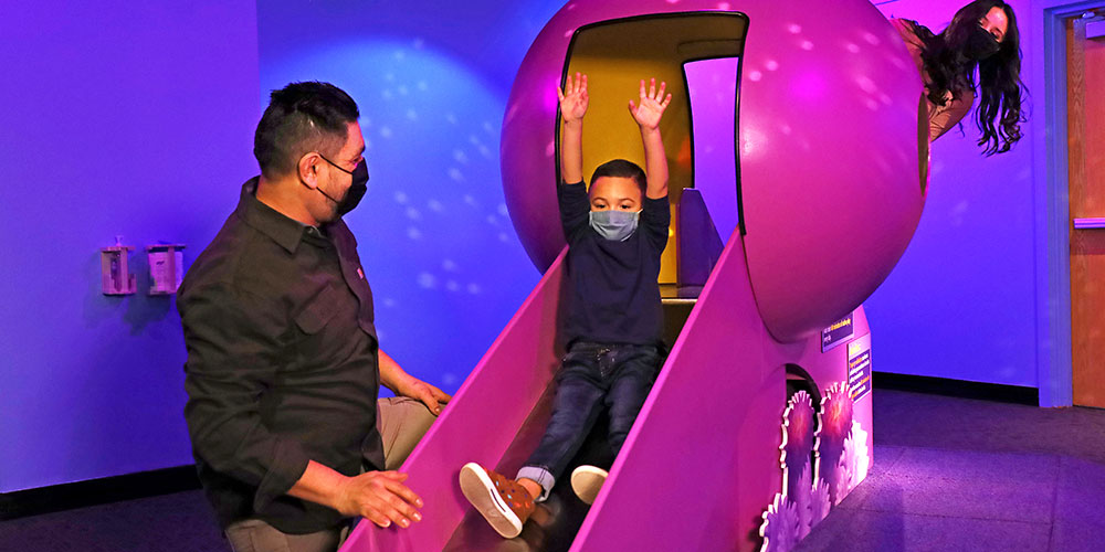 Family playing at The Children's Museum of Indianapolis