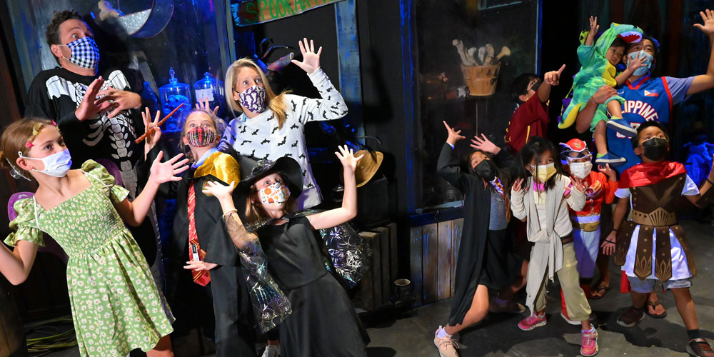 Crowd wearing costumes at The Children's Museum Guild's Annual Haunted House