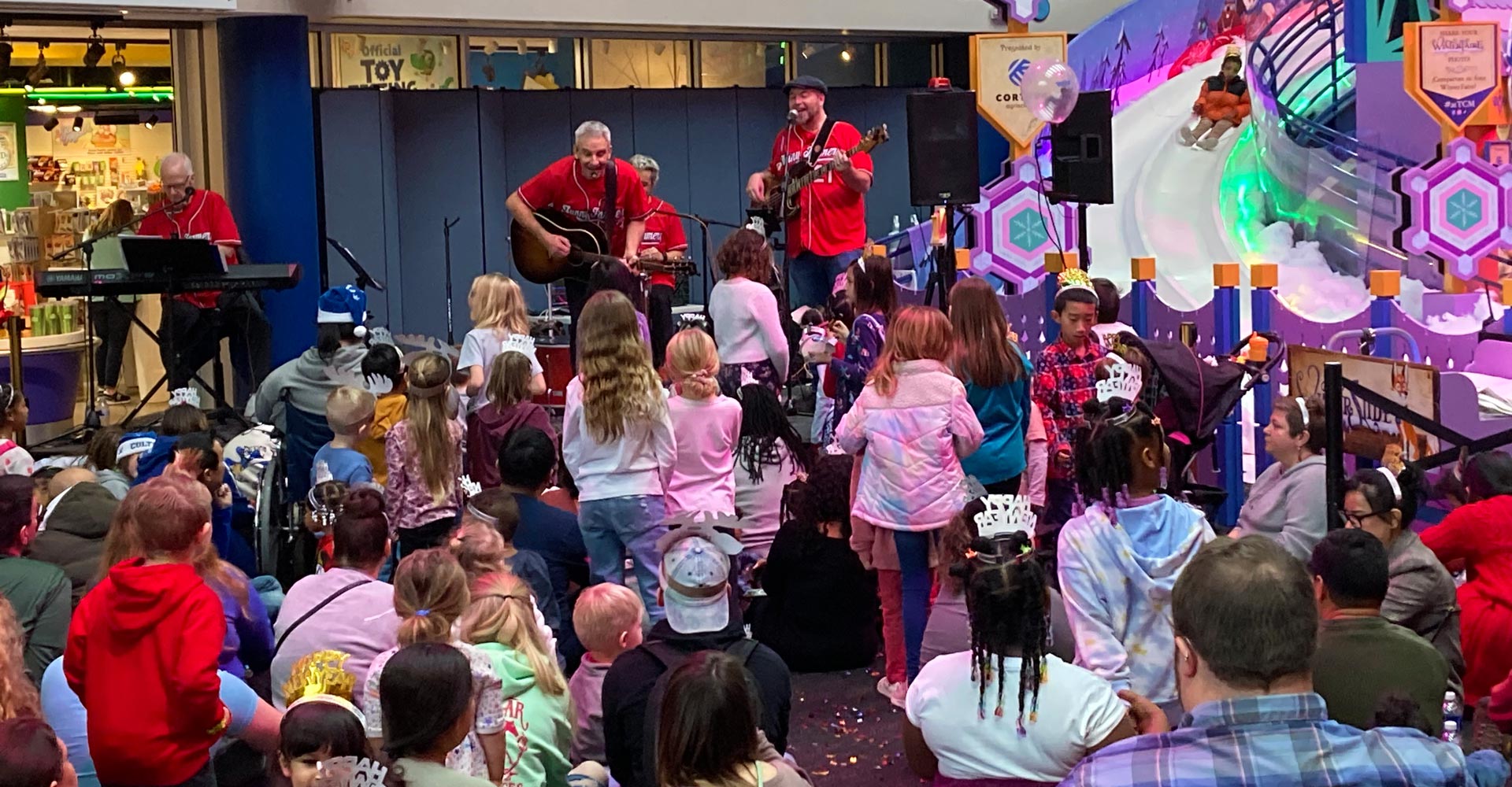 Zak Morgan and band performing on stage.