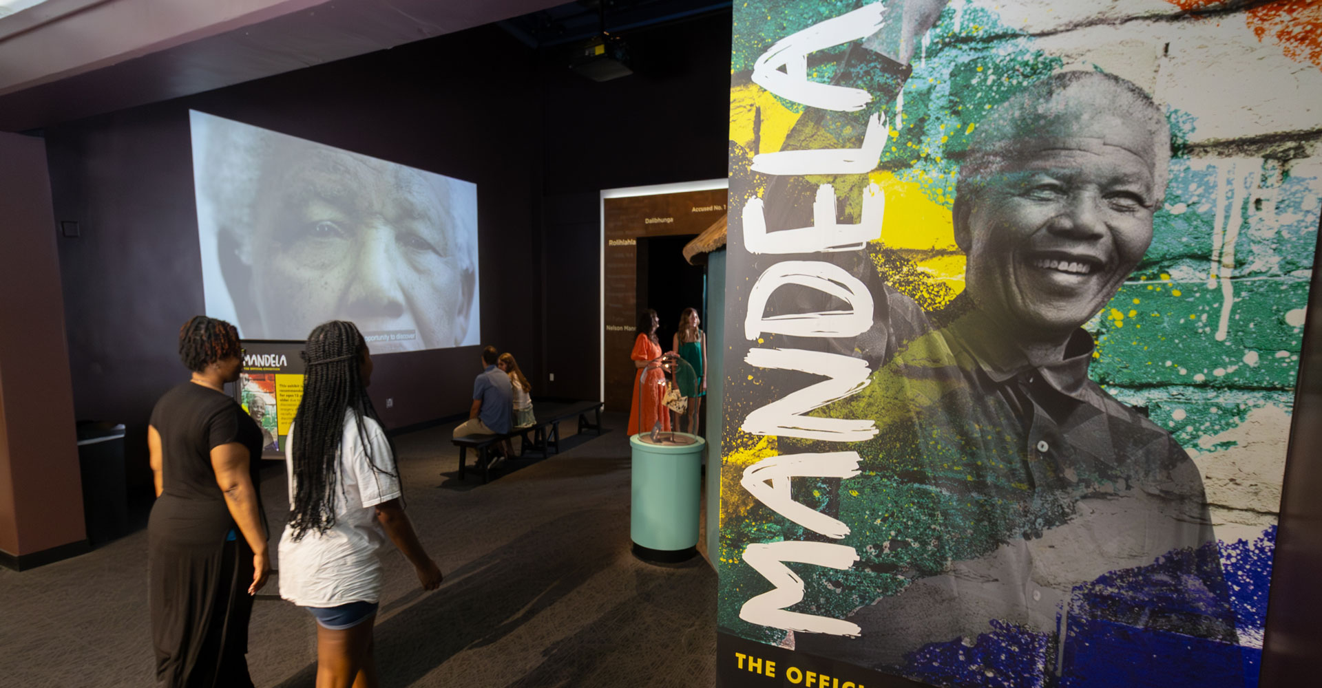Photo of people entering the Mandela: The Official Exhibition exhibit.