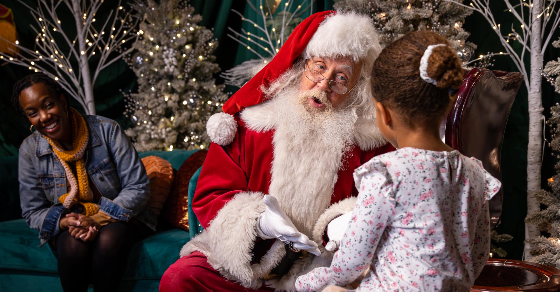 Santa talking with child.