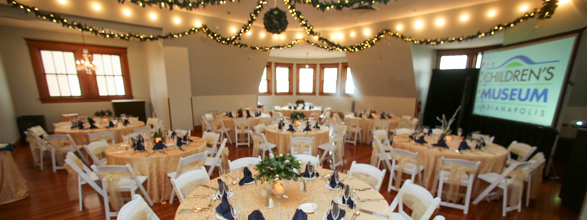 Tables with holiday decorations set up in the Manor