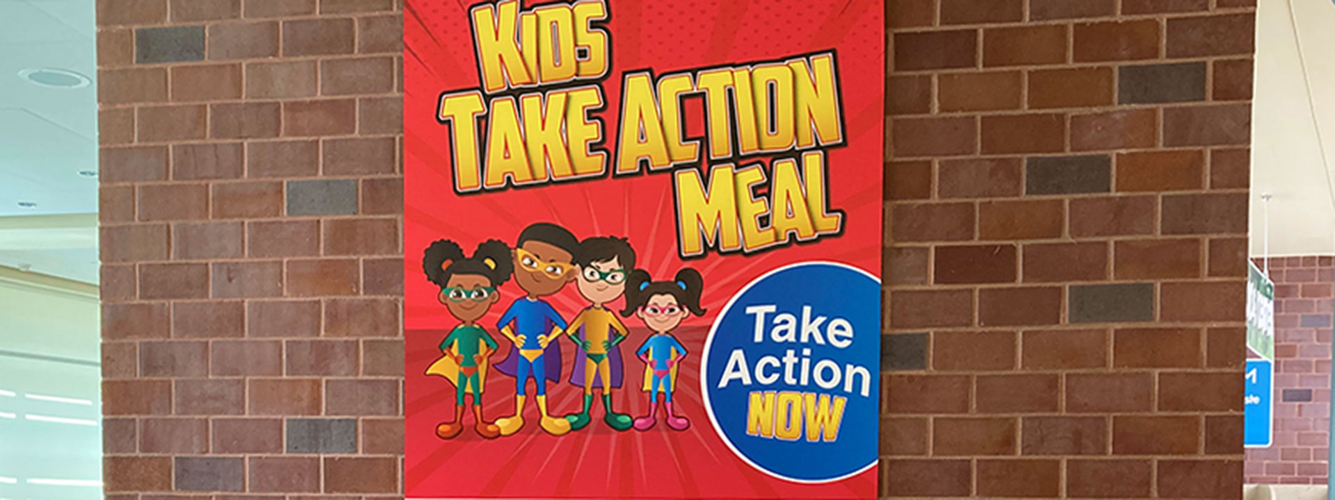 Sign for the Kids Take Action Meal inside the Food Court