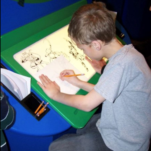11 year-old Alex Henry drawing at the animator light table at The Children's Museum of Indianapolis in 2009