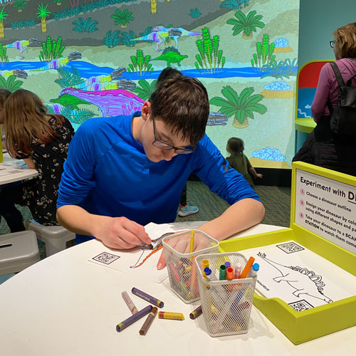 Teen coloring dinosaur picture.