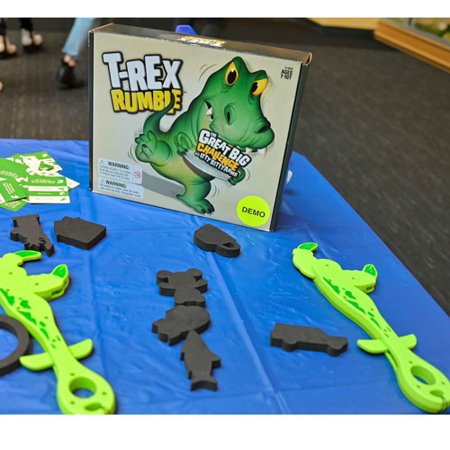 All of the game pieces for T-REX Rumble.