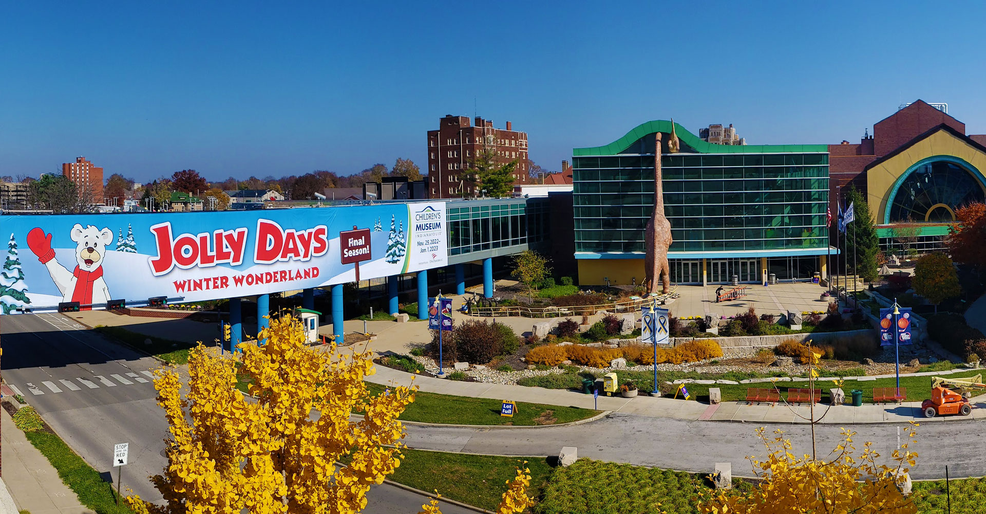 Wide shot of the outside of the museum showing the Jolly Days banner on the skywalk.