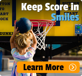 Small child wearing dress and shooting a basketball. Text says "Keep score in smiles."